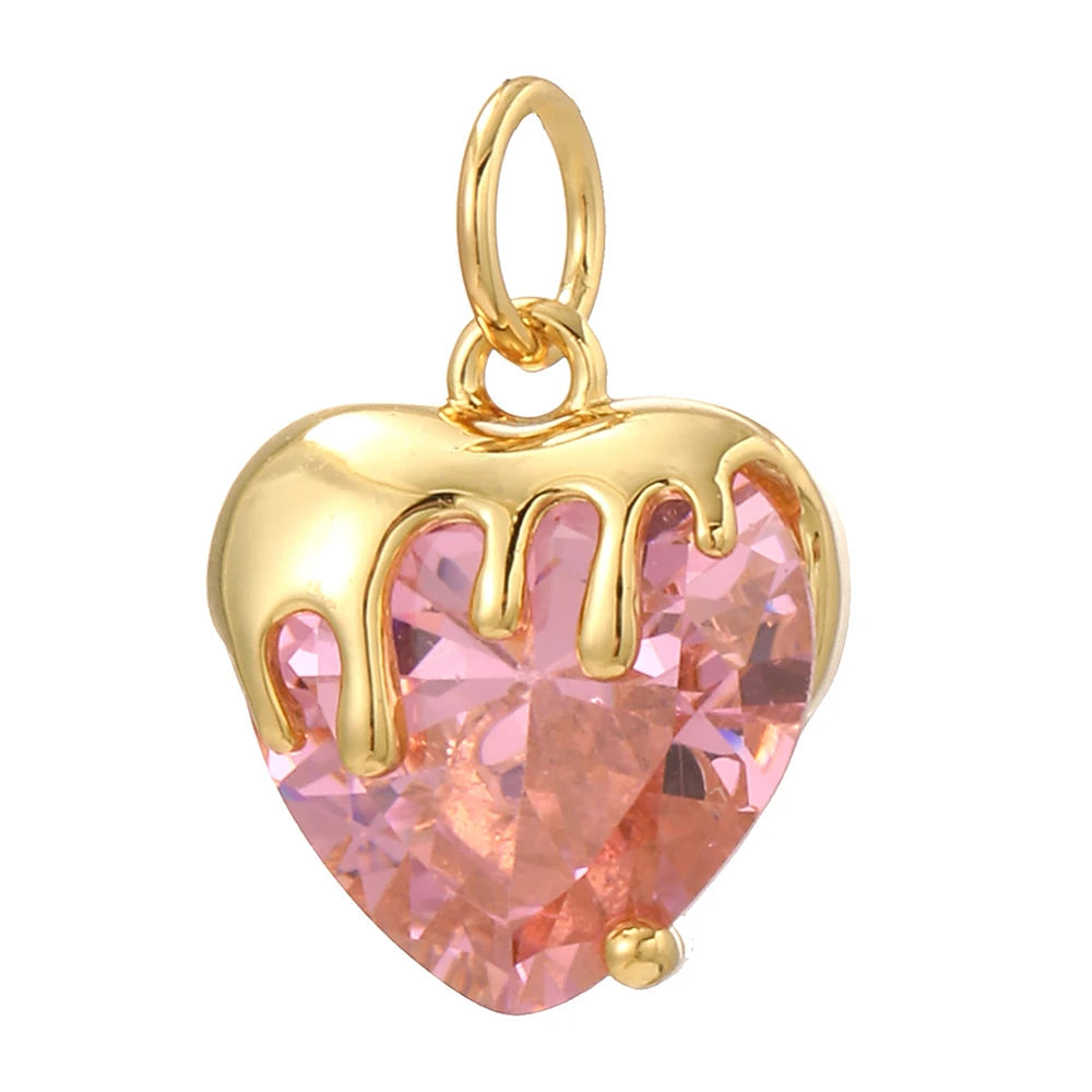 Melting Heart charm featuring a pink heart-shaped diamond with melted gold details. Juicy, sexy, girly and glamorous, this bold Charmeez charm is perfect for custom jewelry, statement bracelets, trendy necklaces and playful, seductive creations.