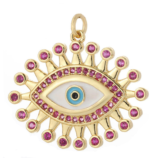 A Thousand Views golden charm with mother-of-pearl evil eye and pink gemstone sunburst, inspired by Arabian Nights