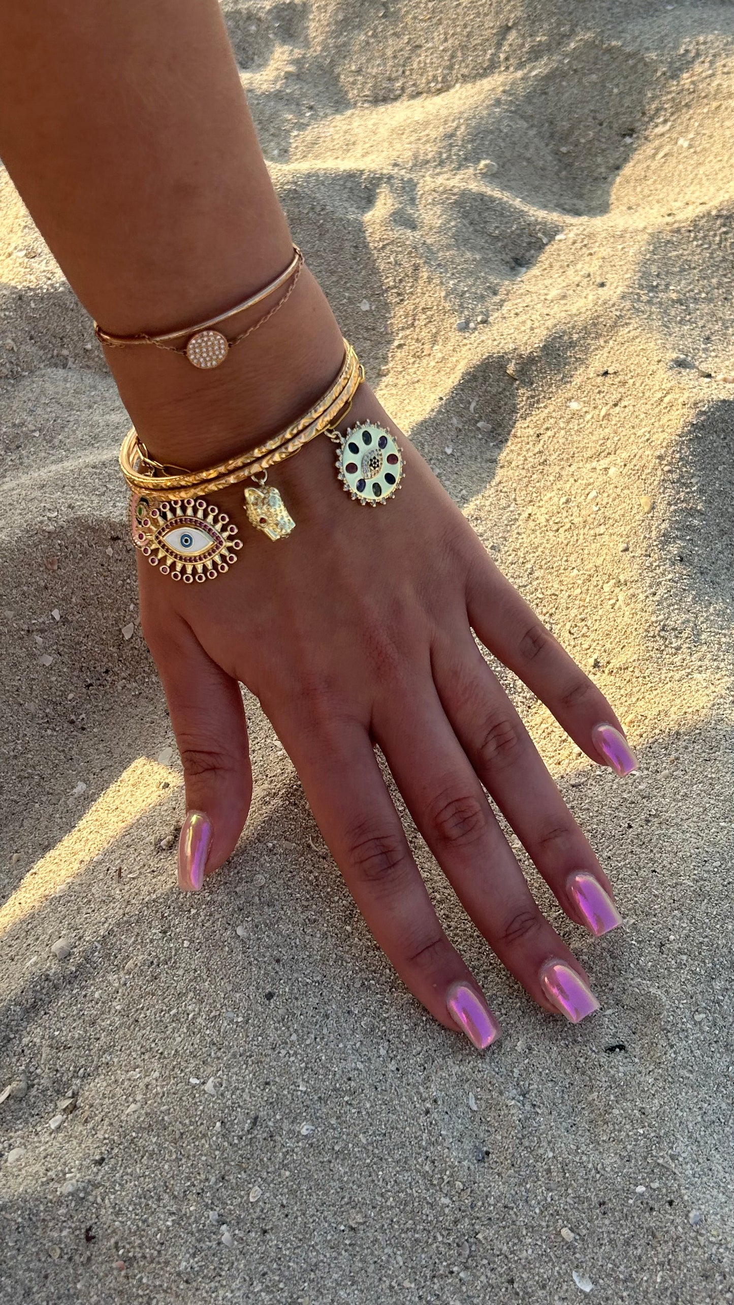 Gold-tone Arabian Nights bracelet adorned with charms for personalized jewelry