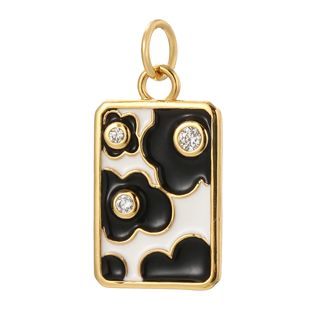 Ebony Bloom charm, Charmeez gold charm, floral jewelry charm, black and white enamel pendant, zircon crystal charm, elegant flower motif, modern romantic jewelry, refined sophisticated design, DIY jewelry supplies, custom charm for necklaces bracelets earrings, timeless accessory, feminine, minimal, classy