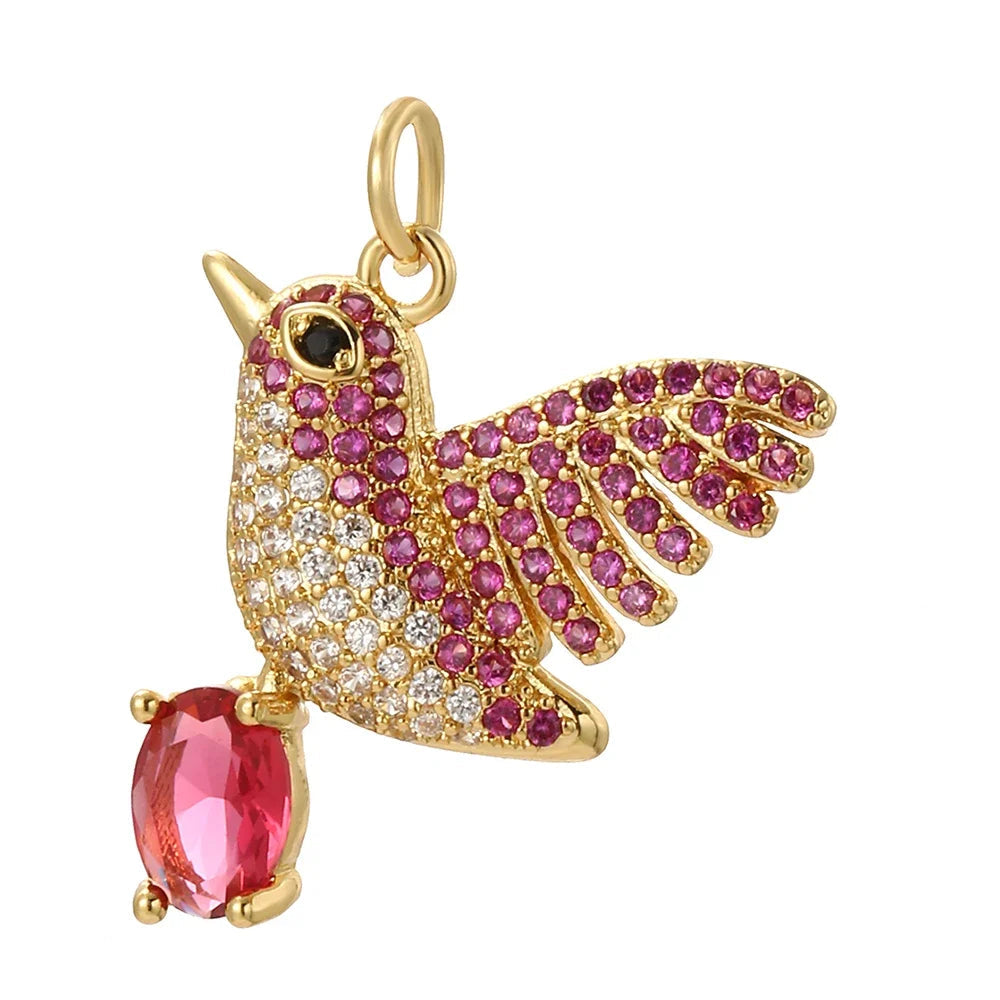 Robber bird charm with pink and silver crystals, holding a pink diamond. A fancy, refined piece for custom elegant jewelry